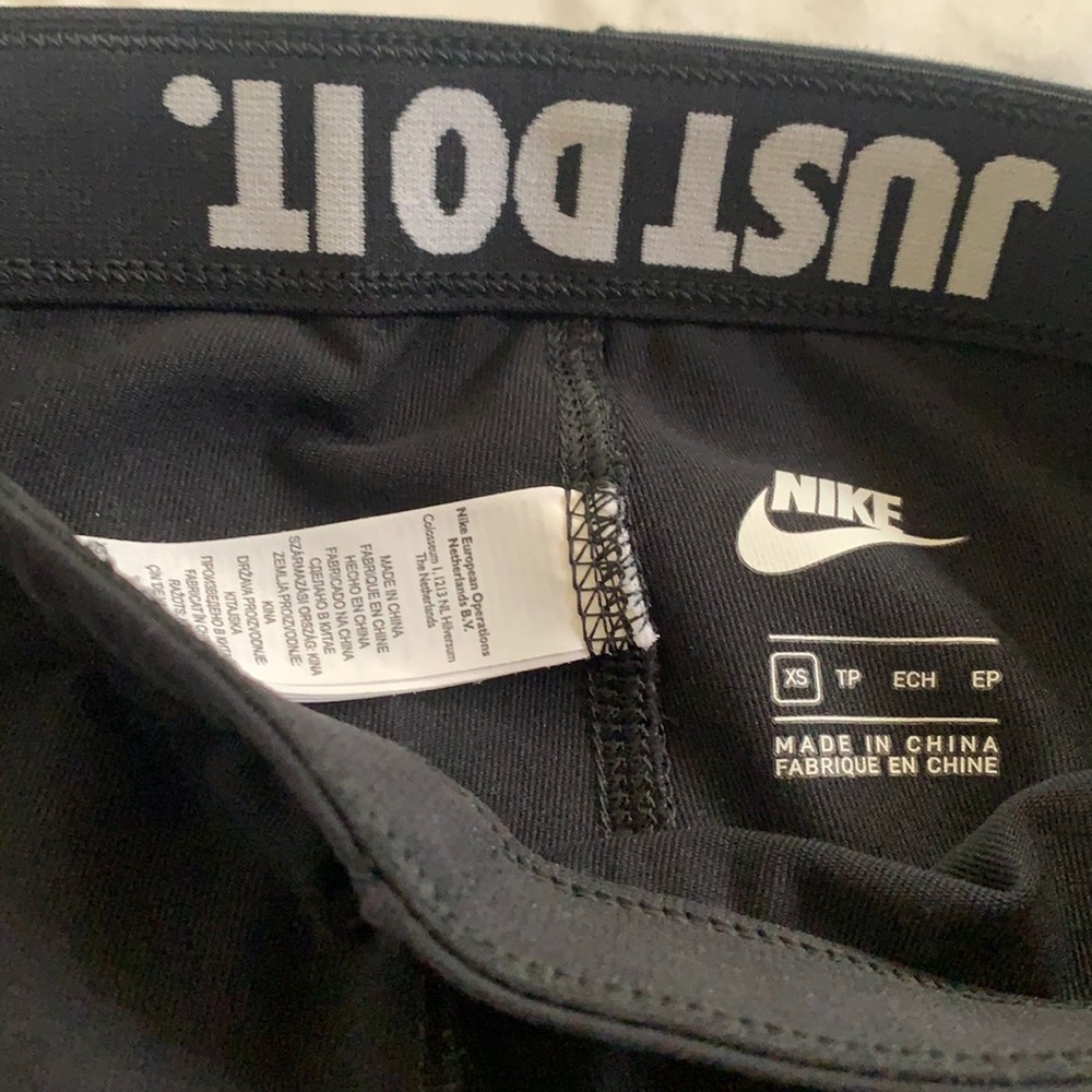 Black nike leggings with white logo ..size XS